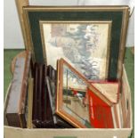 A box of framed prints and advertising mirrors