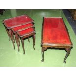 A leather topped coffee table and nest of three tables