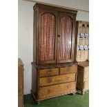 A Victorian oak bookcase on chest two over two