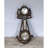 A very nice carved oak clock barometer depicting dolphins and anchor. 85cm tall