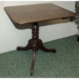 An Regency mahogany tilt top table