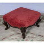 An upholstered foot stool