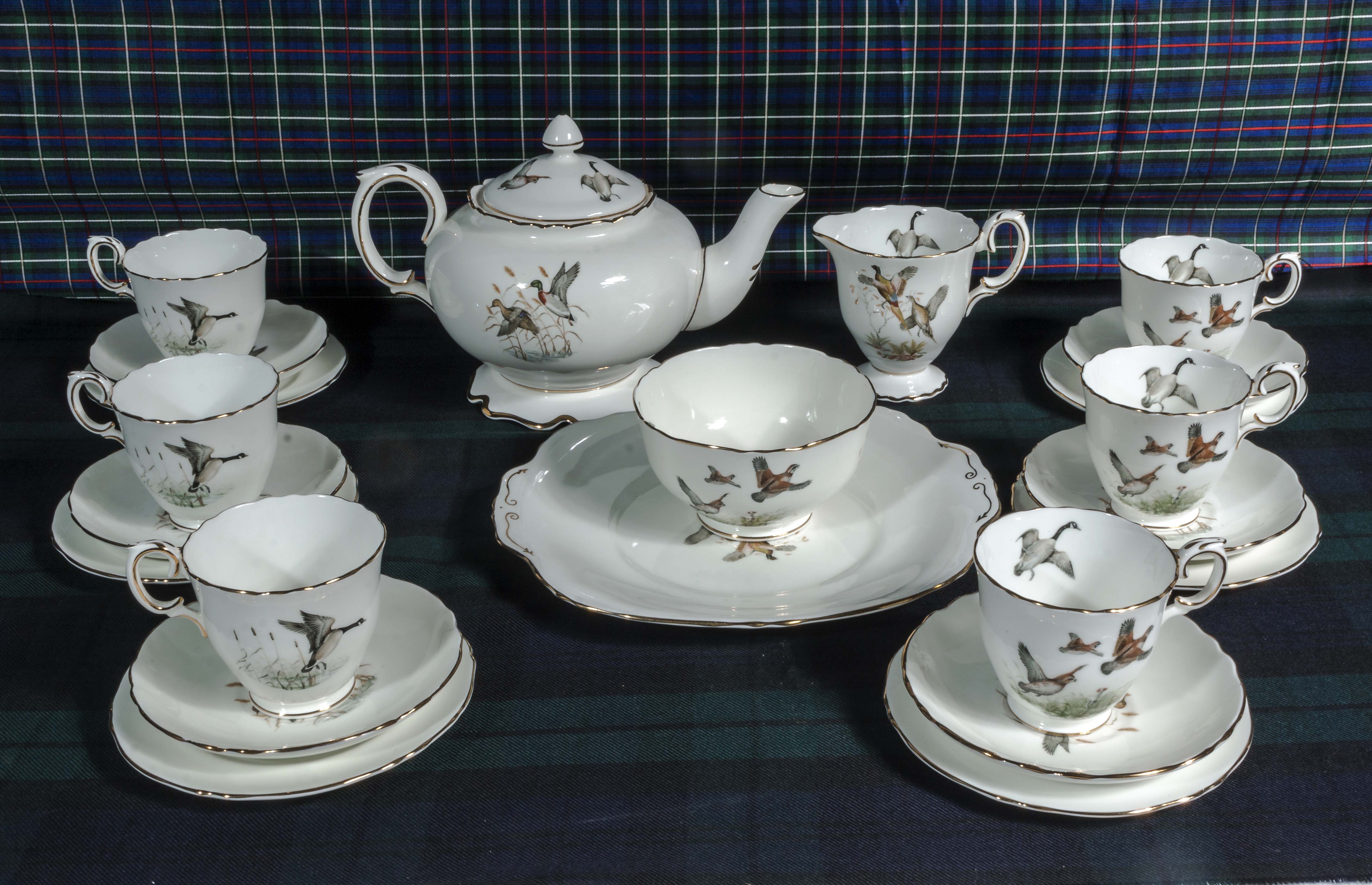 A Crown Staffordshire china tea set decorated with game birds