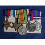 A group of five WW11 medals including a France and Germany war and defence medal. 5383277 PTE E.