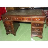 A reproduction pedestal desk