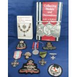 Two books relating to medal collectors together with medals and badges