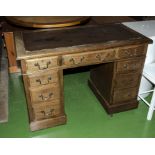 An oak pedestal desk