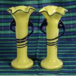 A pair of lemon and blue fluted glass vases