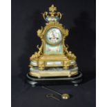 A good quality ormolu clock with porcelain panels. With glass dome