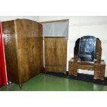 A 1930's walnut bedroom suite comprising wardrobe, tallboy and dressing table