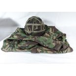 A waterproof camouflage jacket together with a camouflage helmet