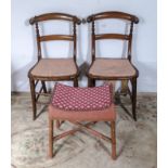 A pair of dining chairs together with a foot stool