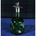 A silver topped green glass decanter