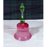 A cranberry glass bell