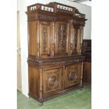 A continental carved dining room cupboard