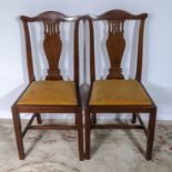 A pair of dining chairs