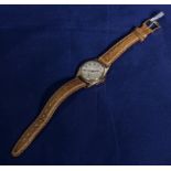 A 9ct gold watch with leather straps