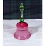 A cranberry glass bell