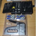 A staple gun and small tool set