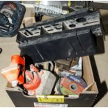 A box containing assorted tools and a mitre block