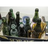 A box containing glass bottles and jugs