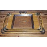 A set of three trays together with a crumb tray