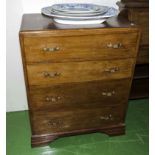 A 1950's oak chest of four drawers