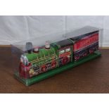 A biscuit tin modelled as a train and rolling stock