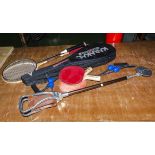 Two squash racquets, two badminton racquets, table tennis bats exerciser and a shooting stick