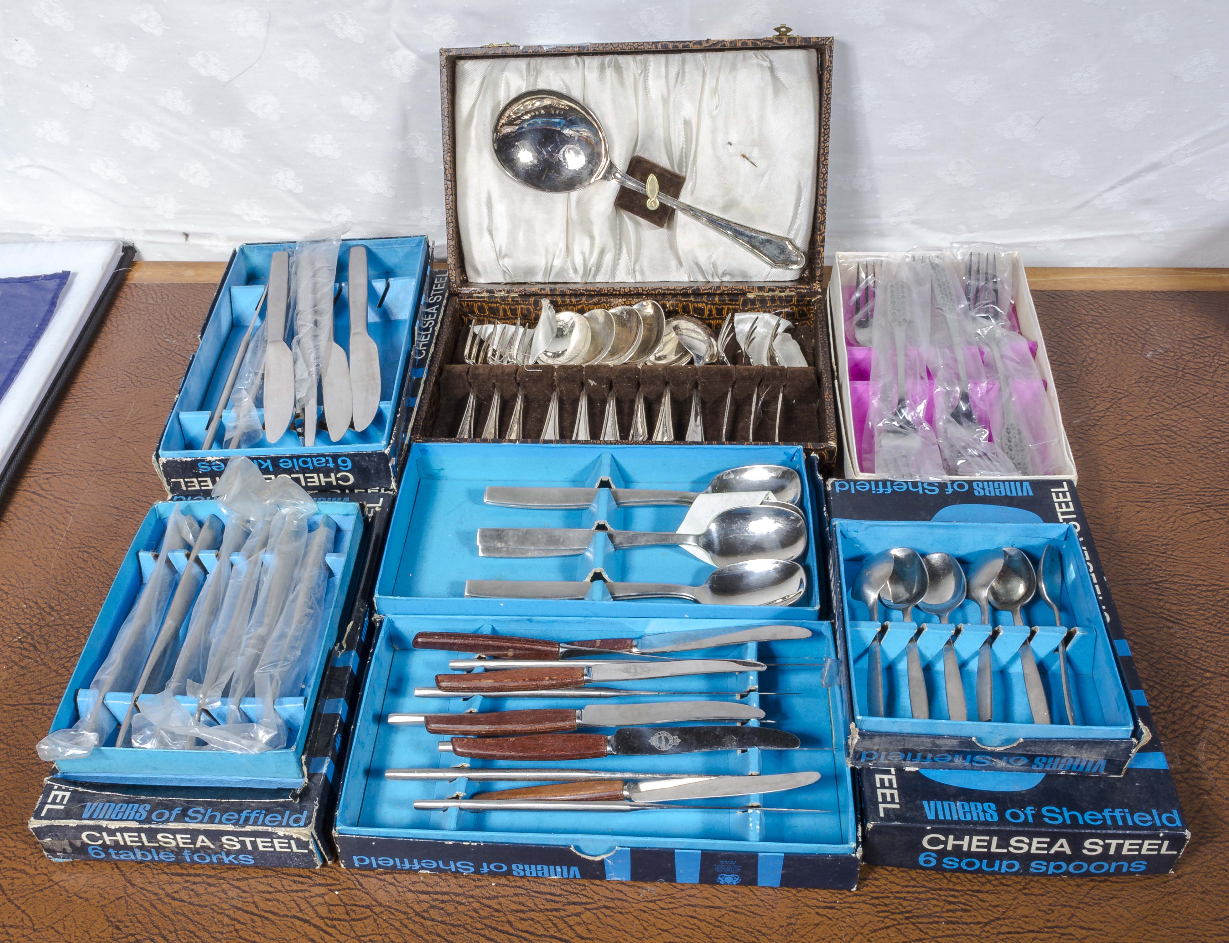 A quantity of boxed cutlery