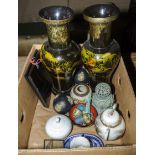 A box containing ornamental vases and other items