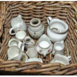 A small basket containing pottery jugs