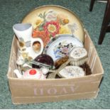 A box containing assorted pottery items and a dressing table set