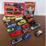 A collection of model cars, train set and a book