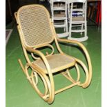 A modern pine bergere rocking chair