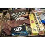 A box containing Star Wars dolls and other toys
