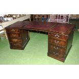 A pedestal desk with leather insert