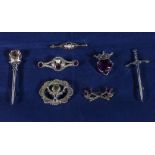 Six Scottish brooches and a bar brooch inset with pearls