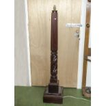 A mahogany carved standard lamp