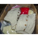 A box containing Arran knitwear