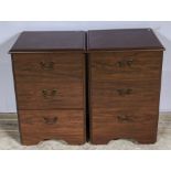 A pair of bedside cabinets
