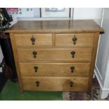 An oak chest of drawers two over three