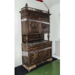 A carved oak Continental cabinet A/F