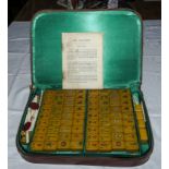 A cased set of Mah Jong tiles