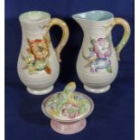 A Clarice Cliff vase, jug and a trinket dish