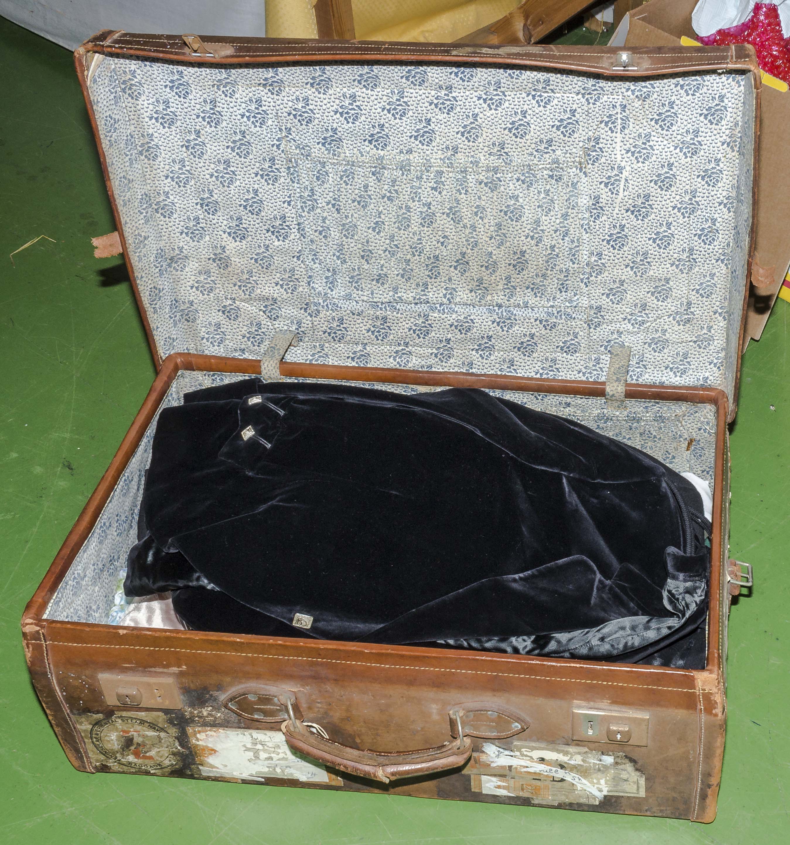 A suitcase containing clothing