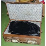 A suitcase containing clothing