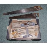 Box containing vintage chisels, planes and two saws