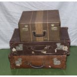 Two vintage suitcases and one other