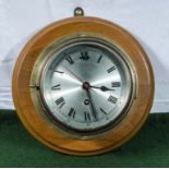 A brass bulkhead clock.